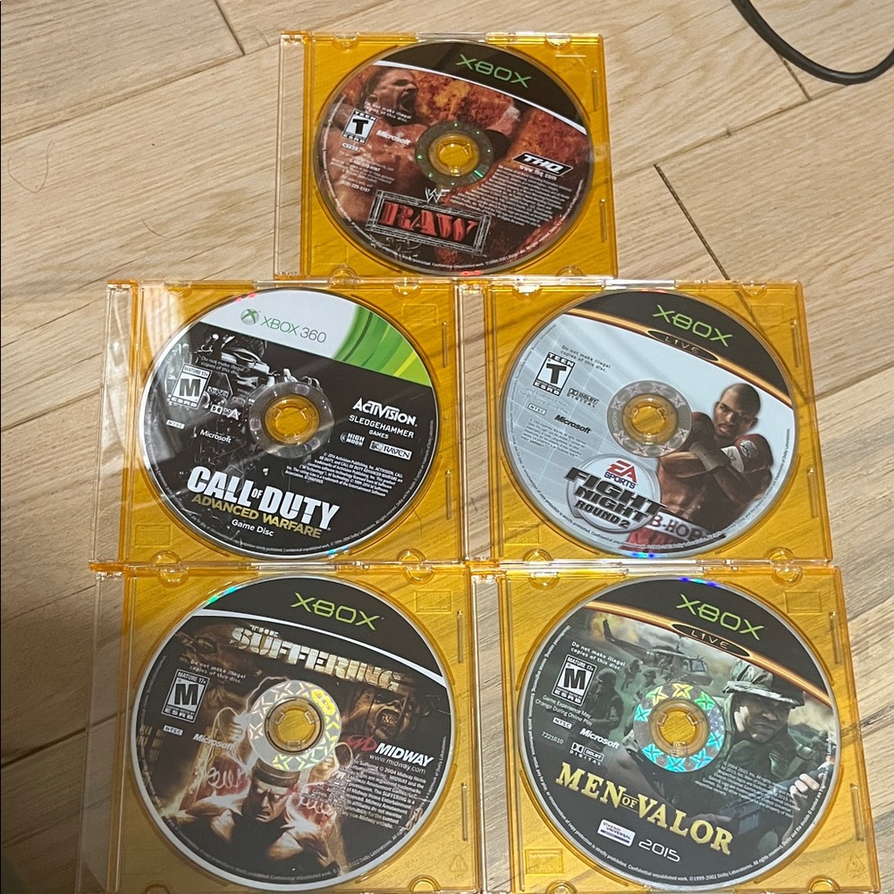 Xbox Video Game Disc Set with Orange Cases